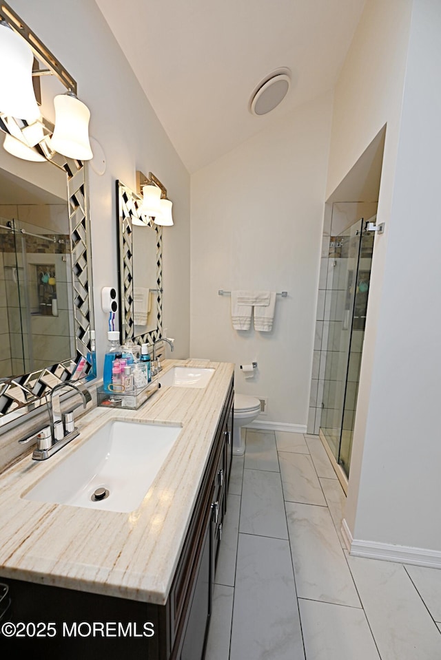 bathroom with vaulted ceiling, a sink, and a shower stall