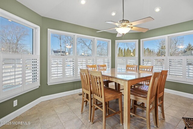 sunroom / solarium with ceiling fan