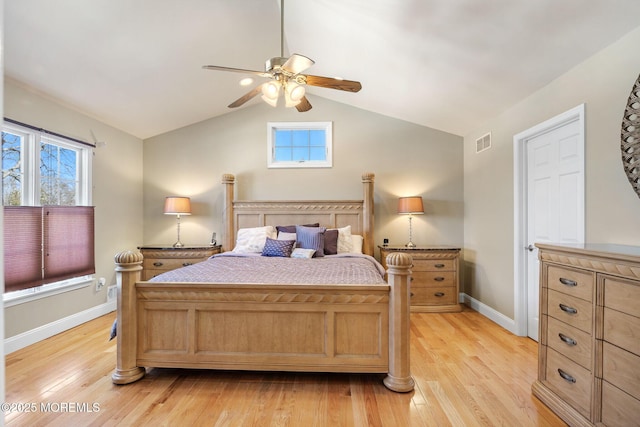 bedroom featuring lofted ceiling, multiple windows, light wood-type flooring, and visible vents