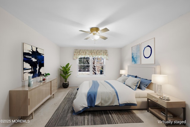 bedroom featuring a ceiling fan and light carpet