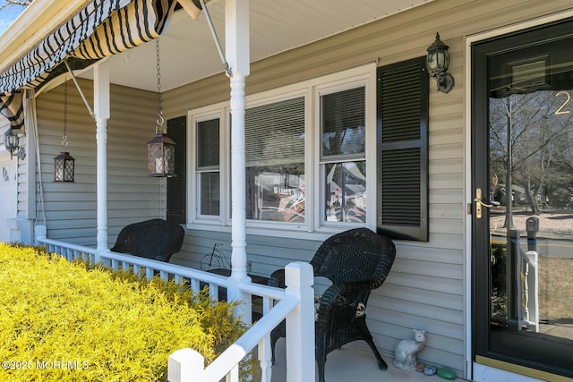 view of property exterior featuring covered porch