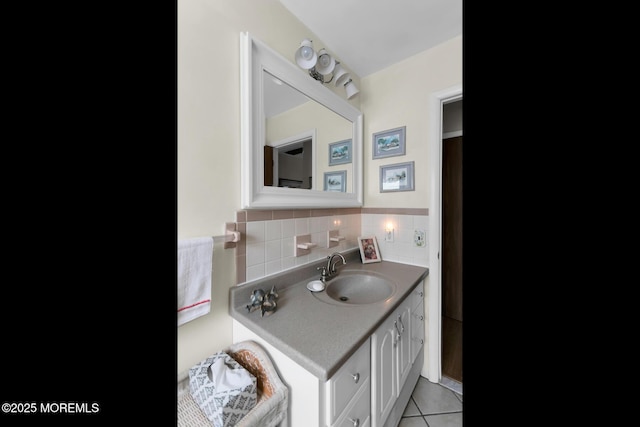 bathroom featuring tile patterned flooring, tasteful backsplash, and vanity