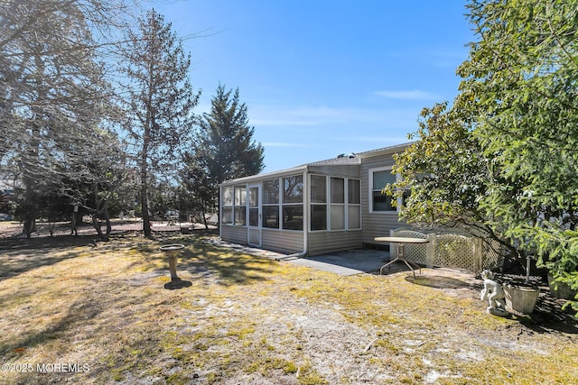 view of yard with a sunroom