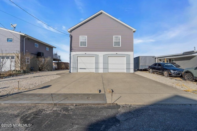 view of front of property featuring a garage and driveway