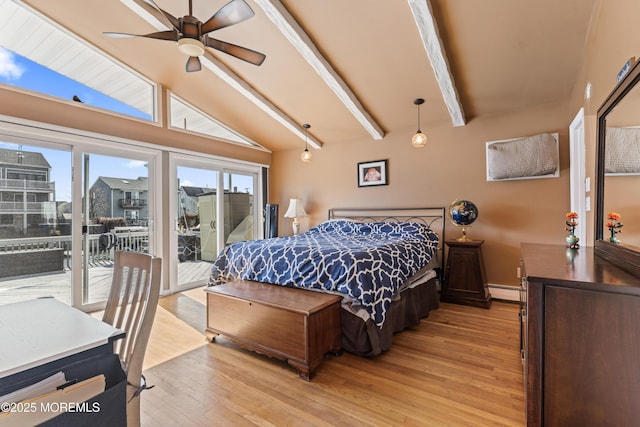 bedroom with access to exterior, light wood-type flooring, a city view, and vaulted ceiling with beams