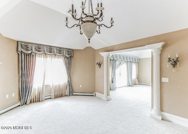 carpeted spare room featuring a baseboard heating unit, baseboards, ornate columns, and a chandelier