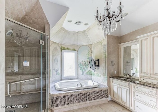 full bathroom featuring tile patterned floors, visible vents, a garden tub, a stall shower, and vanity