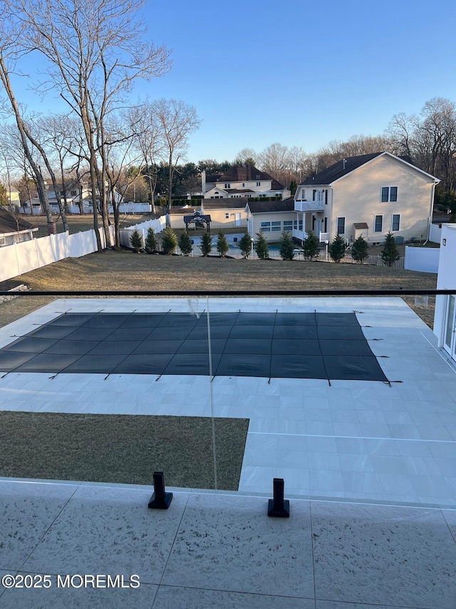 exterior space with a residential view and fence