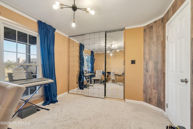 interior space with crown molding, wooden walls, and baseboards