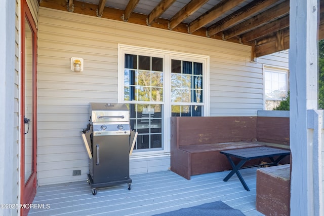 wooden terrace featuring area for grilling