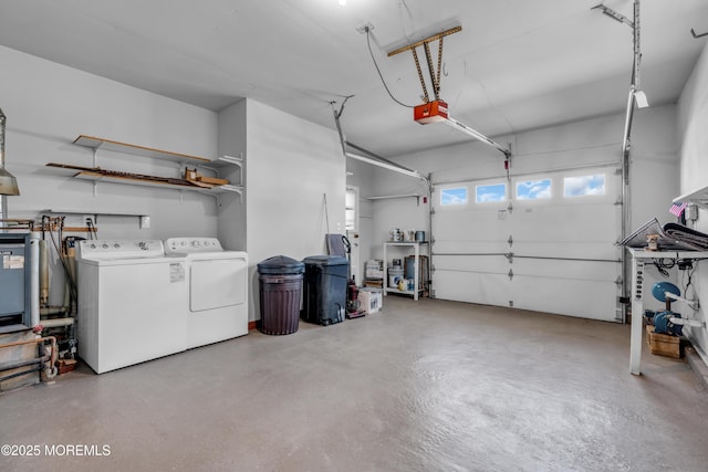 garage featuring a garage door opener and washing machine and clothes dryer