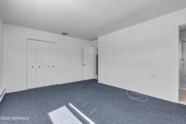 unfurnished bedroom featuring baseboards, carpet, visible vents, and a closet