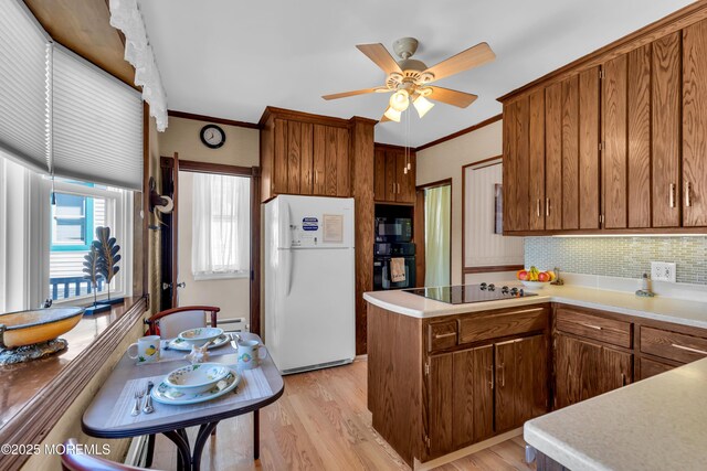 2-4 NE Central Ave, Seaside Park, NJ 08752 - kitchen featuring black appliances, crown molding, and light countertops