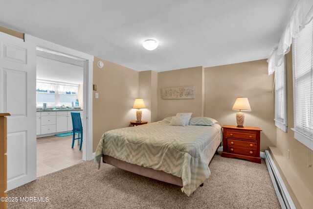 2-4 NE Central Ave, Seaside Park, NJ 08752 - bedroom featuring a sink, a baseboard radiator, and light carpet