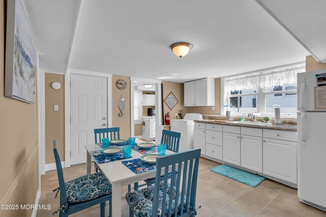 2-4 NE Central Ave, Seaside Park, NJ 08752 - dining area with light tile patterned flooring, baseboards, and separate washer and dryer