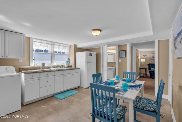 2-4 NE Central Ave, Seaside Park, NJ 08752 - dining area with baseboards and washer / clothes dryer
