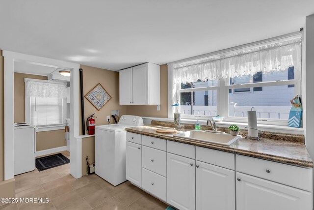 2-4 NE Central Ave, Seaside Park, NJ 08752 - clothes washing area with a sink, washer / clothes dryer, light tile patterned flooring, and cabinet space