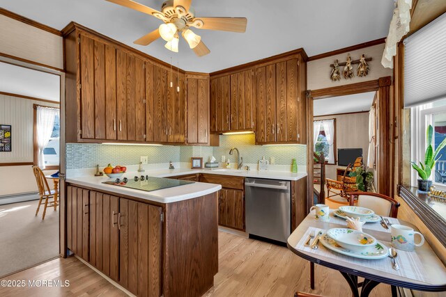 2-4 NE Central Ave, Seaside Park, NJ 08752 - kitchen featuring a peninsula, a sink, light countertops, dishwasher, and black electric cooktop