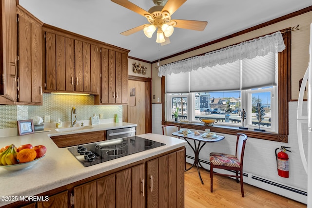 2-4 NE Central Ave, Seaside Park, NJ 08752 - kitchen with a sink, brown cabinetry, light countertops, black electric cooktop, and dishwasher