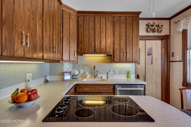 2-4 NE Central Ave, Seaside Park, NJ 08752 - kitchen featuring black electric stovetop, stainless steel dishwasher, brown cabinetry, and light countertops