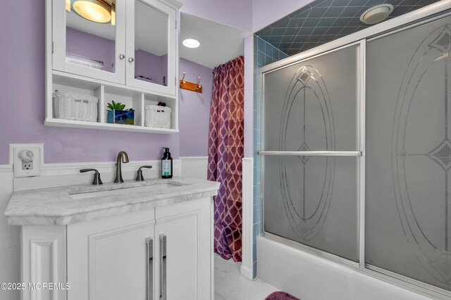 2-4 NE Central Ave, Seaside Park, NJ 08752 - full bath featuring vanity, marble finish floor, a wainscoted wall, and bath / shower combo with glass door