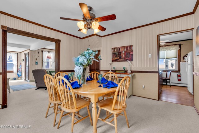 2-4 NE Central Ave, Seaside Park, NJ 08752 - dining space with crown molding, a baseboard radiator, carpet floors, and ceiling fan