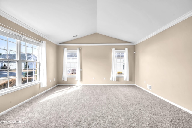 unfurnished room with baseboards, visible vents, vaulted ceiling, crown molding, and carpet flooring