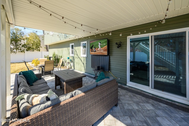 view of patio / terrace featuring outdoor dining space, outdoor lounge area, and fence