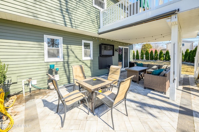 view of patio featuring outdoor dining space and an outdoor living space