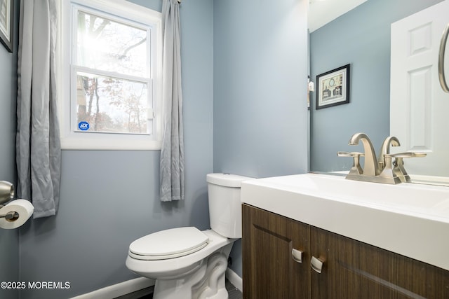 bathroom with toilet and vanity