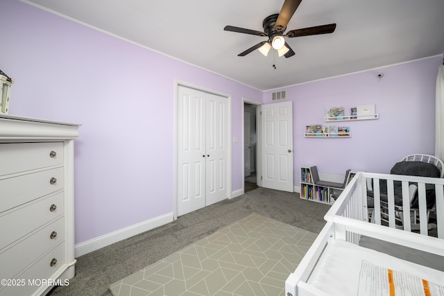 bedroom with visible vents, ceiling fan, baseboards, carpet, and a closet