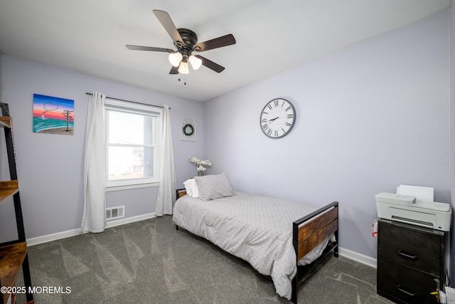 carpeted bedroom featuring baseboards, visible vents, and ceiling fan