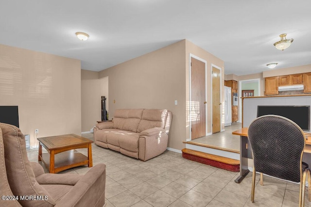 living room with light tile patterned floors and baseboards