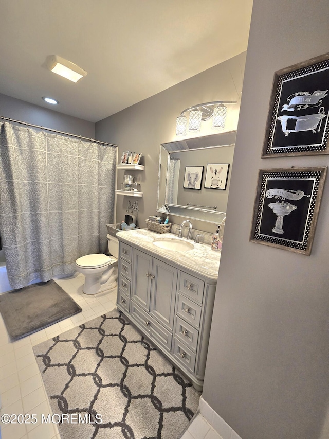 full bath with vanity, toilet, and tile patterned flooring