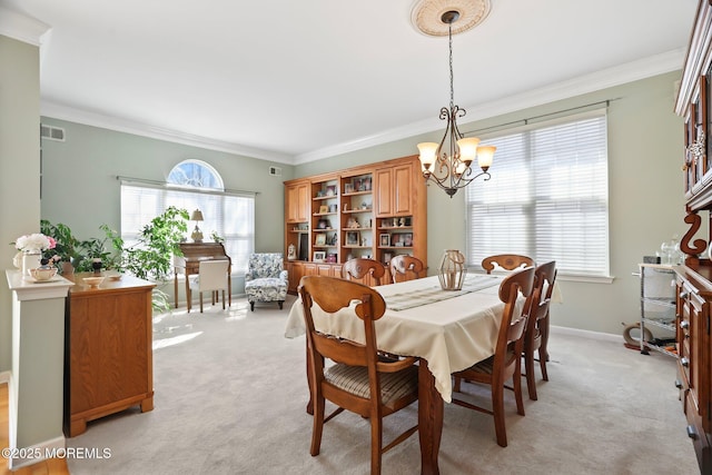 dining space with a notable chandelier, light carpet, visible vents, baseboards, and crown molding