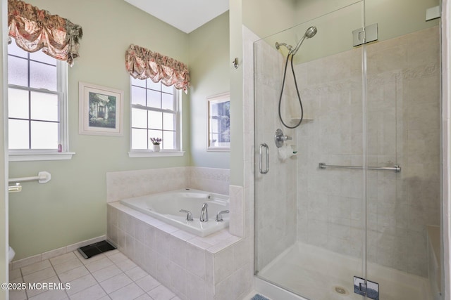 full bath with baseboards, a stall shower, a bath, and tile patterned floors