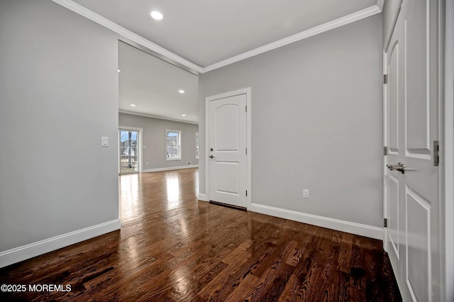 spare room featuring recessed lighting, ornamental molding, baseboards, and wood finished floors