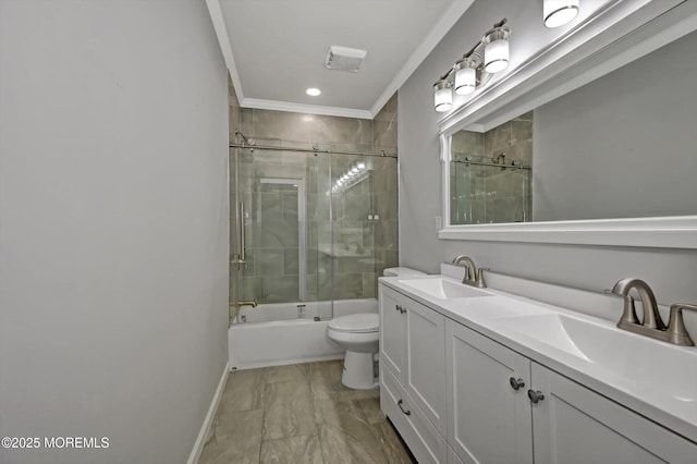 full bathroom featuring toilet, double vanity, shower / bath combination with glass door, marble finish floor, and a sink