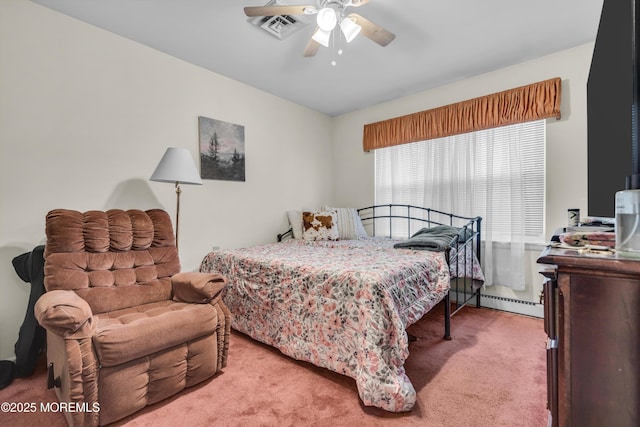 carpeted bedroom with a baseboard heating unit, visible vents, and a ceiling fan