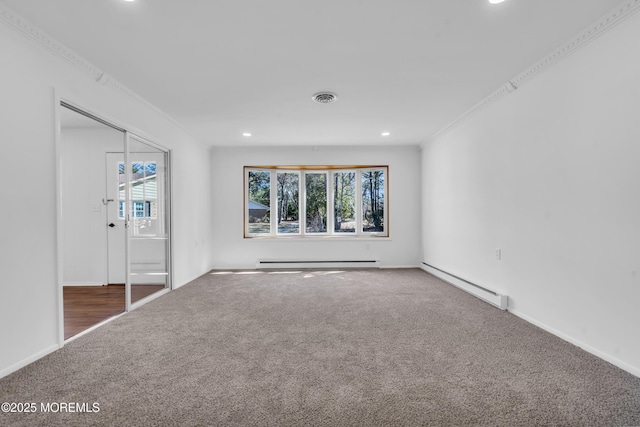 unfurnished bedroom with visible vents, carpet floors, a baseboard heating unit, crown molding, and baseboard heating