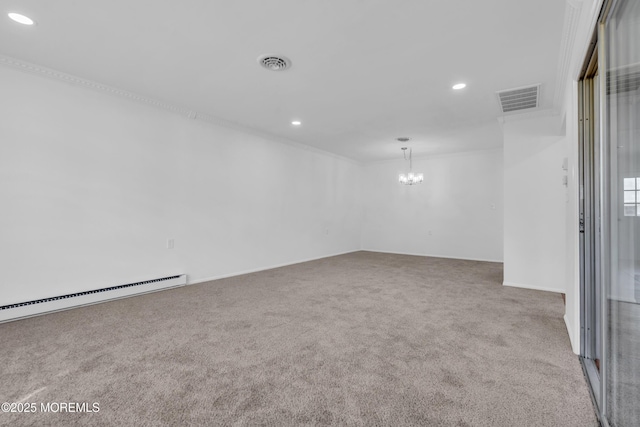 carpeted spare room with an inviting chandelier, visible vents, baseboard heating, and ornamental molding