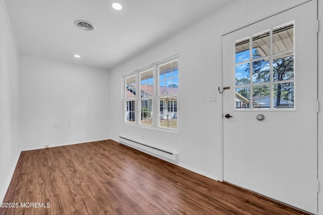 interior space featuring dark wood-style floors, visible vents, baseboards, recessed lighting, and baseboard heating