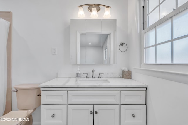 full bathroom featuring toilet and vanity