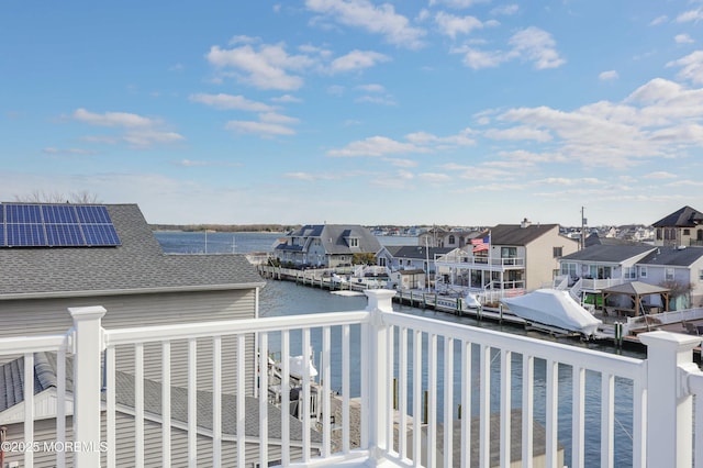 balcony with a water view and a residential view