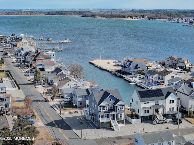 bird's eye view featuring a water view and a residential view