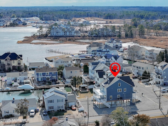 bird's eye view featuring a water view and a residential view