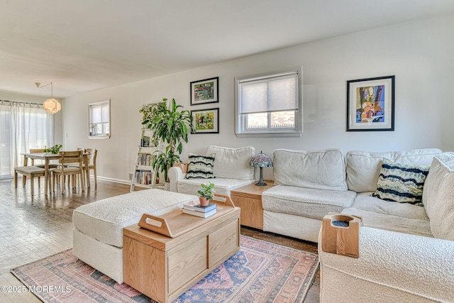 living room featuring baseboards