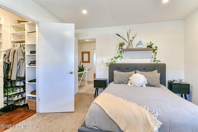 carpeted bedroom featuring recessed lighting