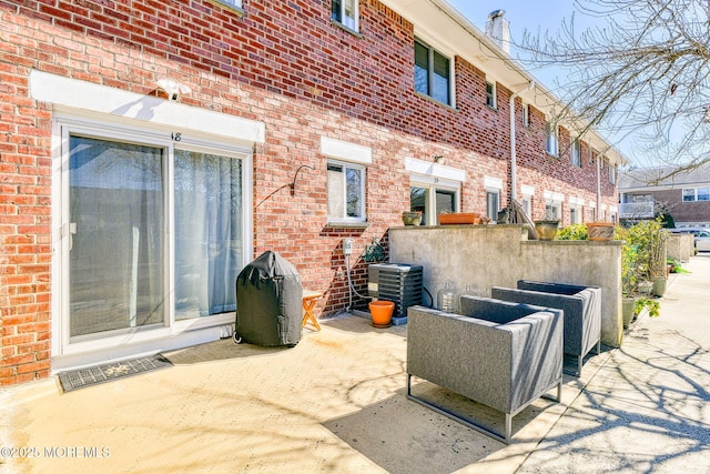 view of patio / terrace with central air condition unit and visible vents