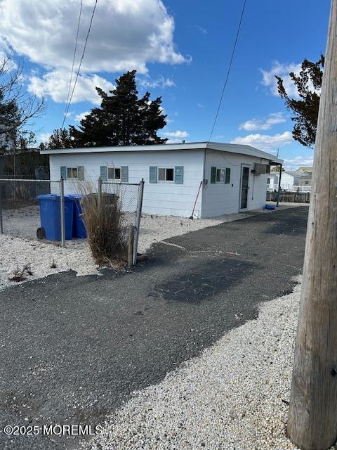 rear view of house with fence